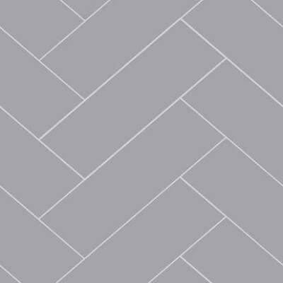 An example of the Fibo Wall Board in Medium Grey Herringbone (4115-M72), featuring a high-gloss light grey finish and a trendy herringbone tile design. Perfect for creating a classy and modern look in any room. Life Quality Bathing.