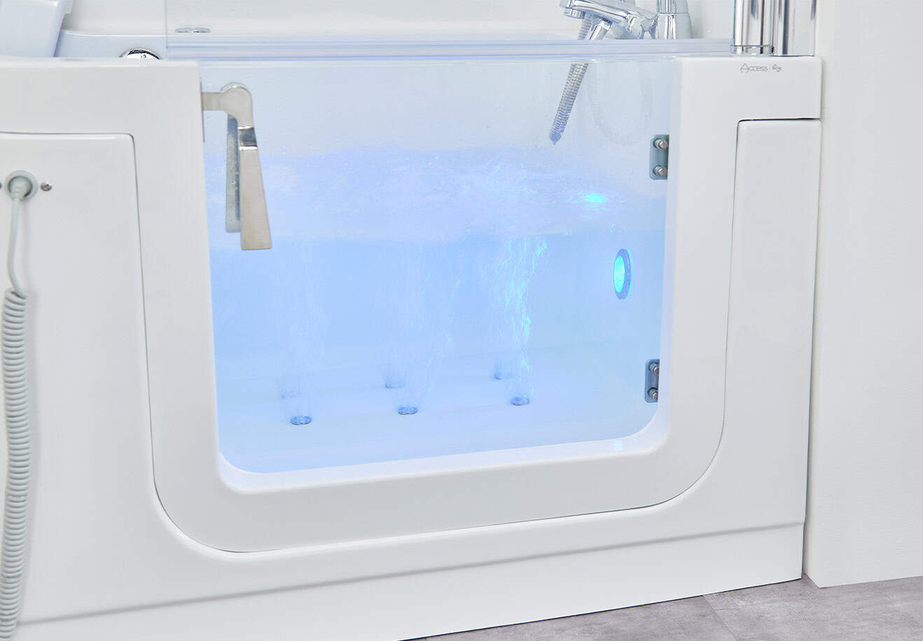 Jet powered bubbles feature seen through glass door of the Venezia. illuminated by blue light