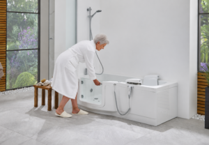 Elderly Woman Opening Walk-in Bath Door